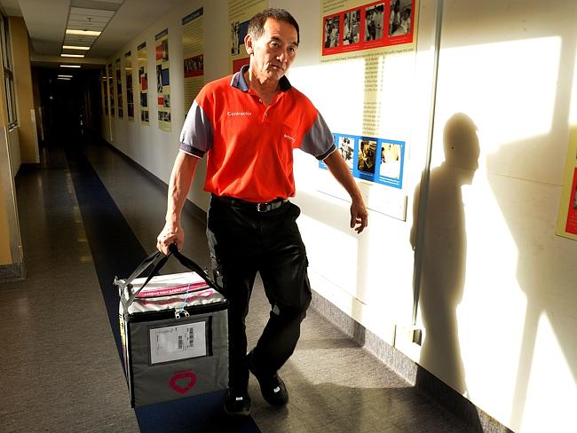 The organ is couriered to its new recipient. Picture: Jay Town