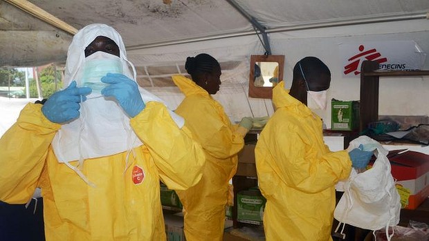 Medecins Sans Frontiers members put on protective gear in Conakry, Guinea.