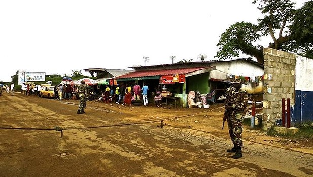 Liberian armed forces monitor a border checkpoint.