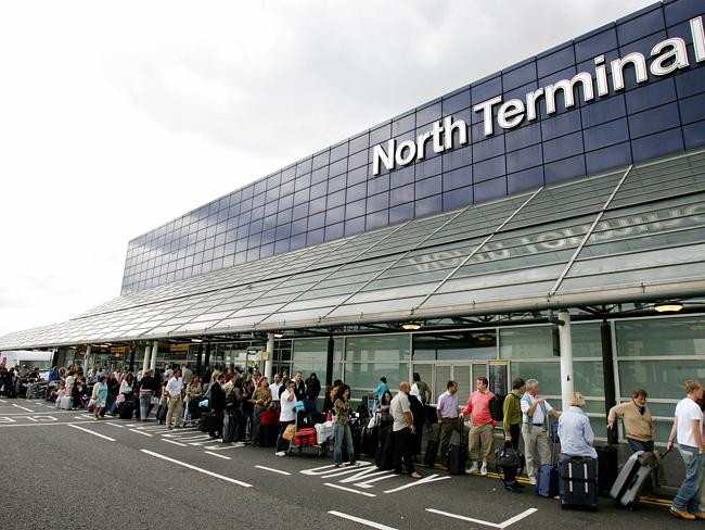 London airport scare ... Panicked airport staff fear for their health after a woman colla