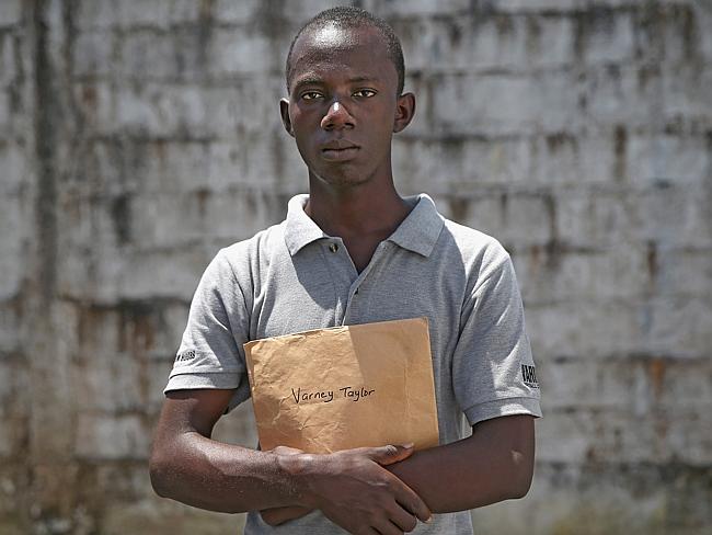 Varney Taylor, 26, stands in the low-risk section of the Médecins Sans Frontières treatme