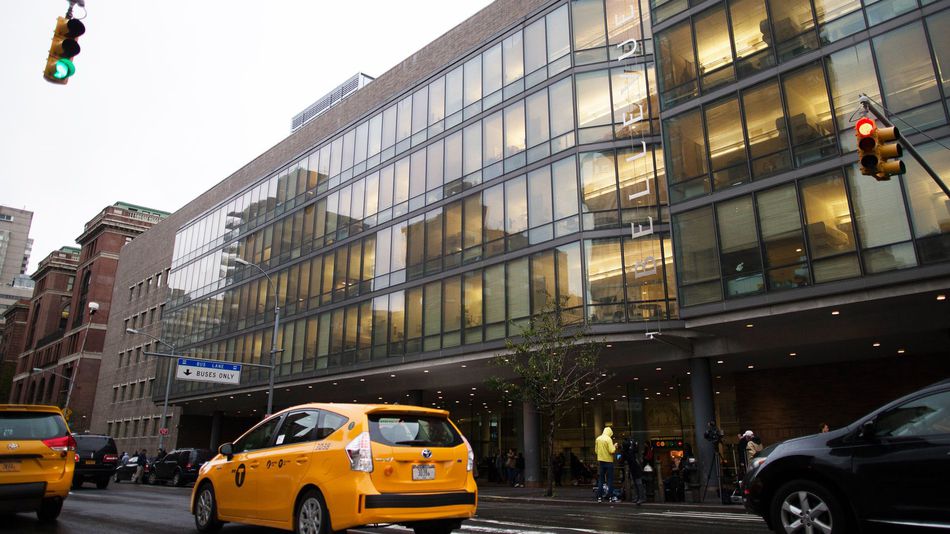 Cars pass Manhattan's Bellevue Hospital where Craig Spencer, a Doctors Without Borders physician who recently returned to the city after treating Ebola patients in West Africa, was rushed to Thursday, Oct. 23, 2014, in New York.