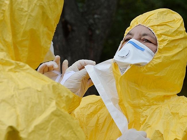 Experts question if protection suits are enough for Ebola