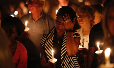 Mamie Mangoe wipes a tear away during a memorial service for Ebola victim Thomas Eric Duncan.