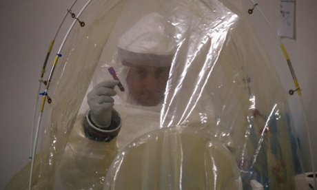 A microbiologist prepares to test blood samples for Ebola at a US navy mobile laboratory in central Liberia.