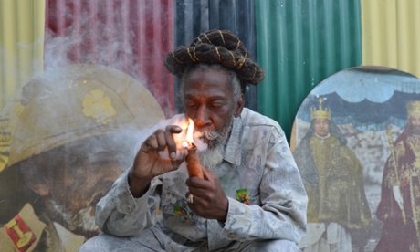 Reggae legend Bunny Wailer, an advocate of legalisation, smokes a marijuana pipe in Kingston in August.