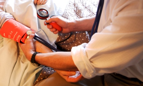 Doctor checking the blood pressure of a patient. Elderly woman