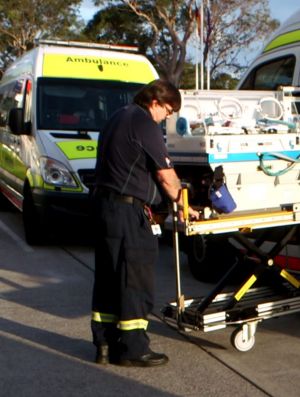 NETS ambulence driver Bruce Dalziell unloads a neonatal life-support system.