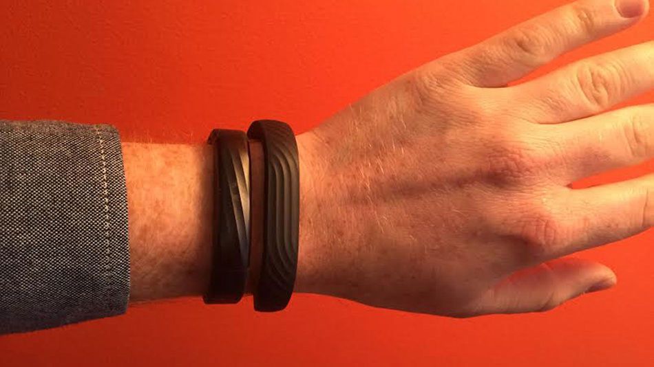 The Jawbone UP3, on the left side of the wrist, is sleeker and smaller than the Jawbone UP24 (right).