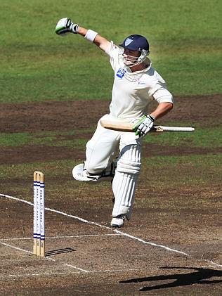 Phillip Hughes celebrates his maiden first class century.