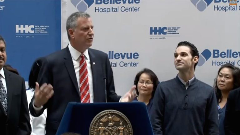 Free of Ebola, New York doctor leaves hospital in hug-filled presser