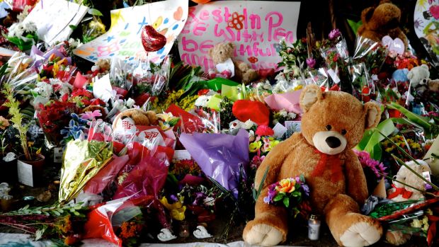 Teddy bears and flowers left for the eight children killed in a Cairns home.