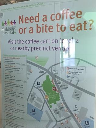 A sign inside the hospital directs those looking for food to a coffee cart or an off-site