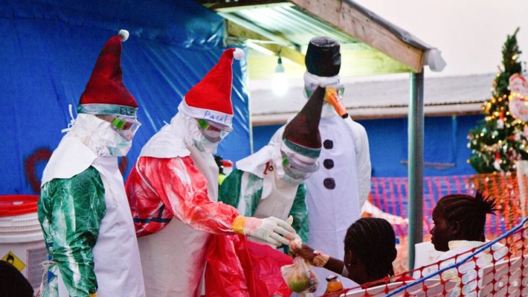 Santa hats and spray paint spruce up Ebola gear for Christmas