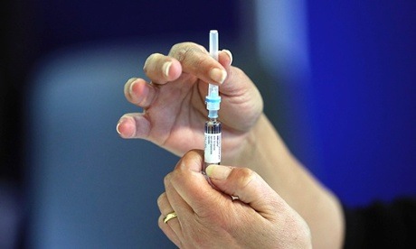 A nurse prepares an MMR jab