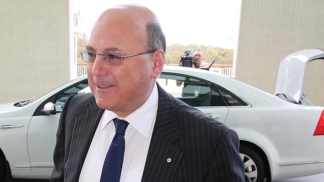 Not unconditional ... Senator Arthur Sinodinos arrives at Parliament House in Canberra th