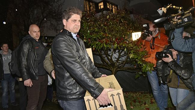 Evidence ... Investigators carry boxes from the apartment of Andreas Lubitz, in Dusseldor