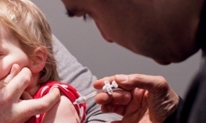 Lauren, age 1 is administered with a vacciantion for flu (influenza).Seasonal flu jab.Flu vaccination.Swine flu.LondonBy David Levene12/1/11