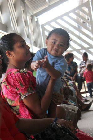 Mothers wait their turn to see a nurse at the Marie Stopes PNG reproductive health outreach clinic during a visit to Joyce Bay settlement, Port Moresby.