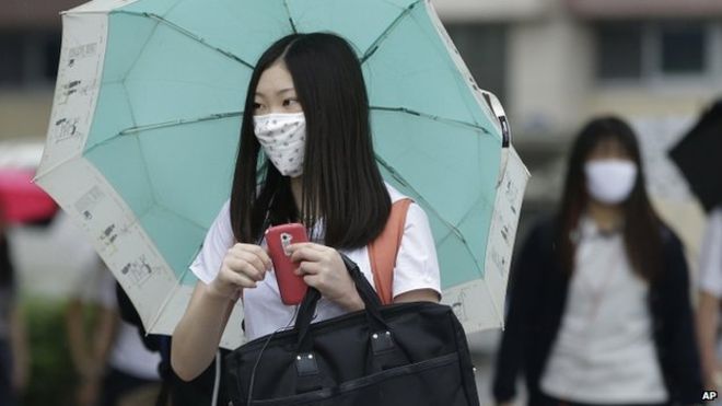 South Korean student wears mask as she goes to school in Seoul on 5 June 2015