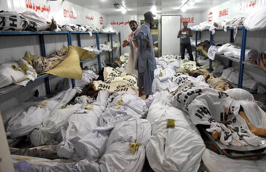 People shift bodies of the victims of a heatwave to a mortuary in Karachi, Pakistan. Doctors from army and civilian rescue agencies have set up dozens of temporary medical camps to treat people with dehydration and heat stroke, the military said.