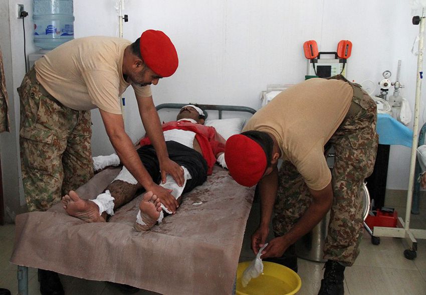 Army doctors examine a patient who was affected by the heatwave, at a medical camp in Hyderabad, Pakistan.