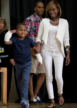 Zion Harvey arrives to a news conference with his mother Pattie Ray.