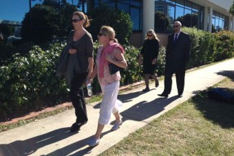 Andrea Shoesmith in pink, Brad Steer behind her.