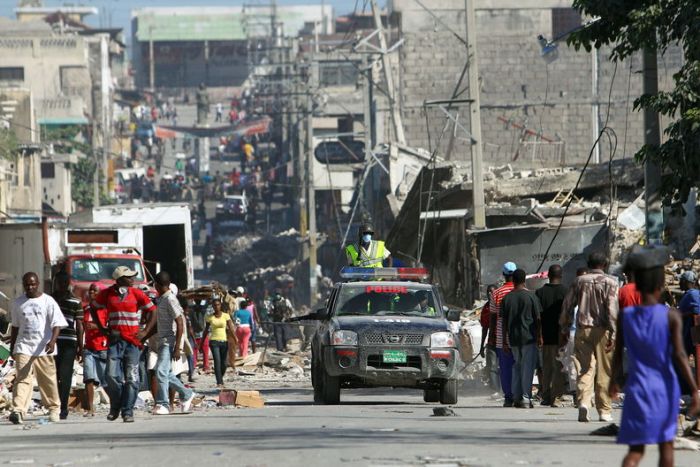 Haitian police patrol on a vehicle in the streets of the centre of Port-au-Prince