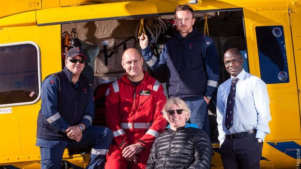 Simon Treloar (front) with the men who helped rescue him from a truck accident.